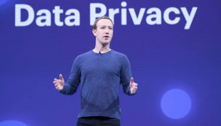 An image of Mark Zuckerberg standing in front of a backdrop that says "Data Privacy" in large letters.