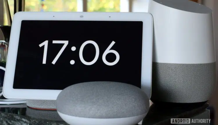 Photograph of Google Home Hub, Home Mini, and Home side by side