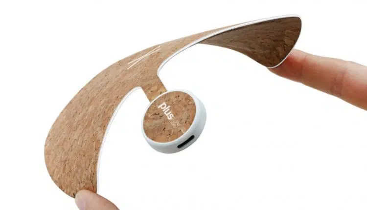 A promotional photo of the Plusus Xpad Wireless Charger being squeezed to emphasize its flexibility.