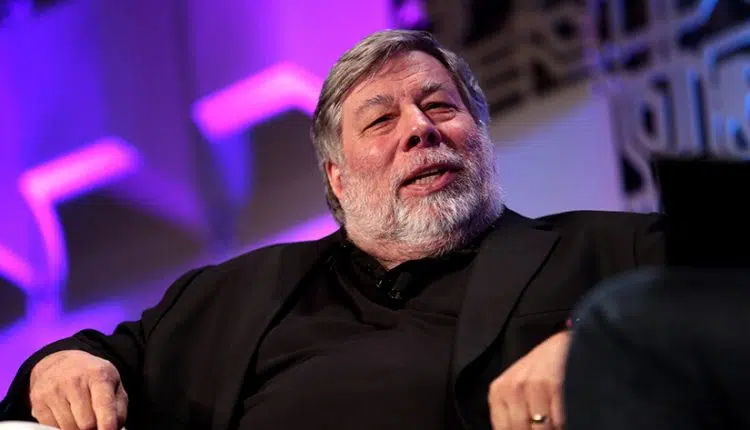 Apple co-founder Steve Wozniak sitting in a chair during an on-stage interview.
